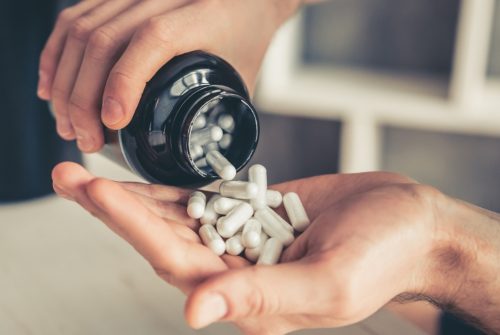 man-with-sport-nutrition-picture-id672627592